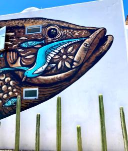 a painting of a fish on the side of a wall at Villa Esterito in La Paz