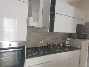 Kuchyň nebo kuchyňský kout v ubytování La Casa di Argo Acquario di Genova, Parcheggio Gratuito, Stazione Sestri