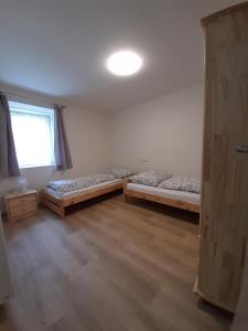 Postel nebo postele na pokoji v ubytování Apartmány Míra