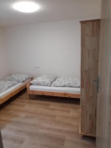 Postel nebo postele na pokoji v ubytování Apartmány Míra