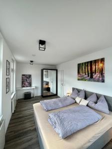 Postel nebo postele na pokoji v ubytování Penthouse im Zentrum von Bregenz