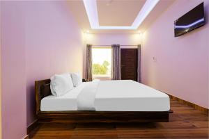 En eller flere senger på et rom på Flagship Bala Shankar Resort