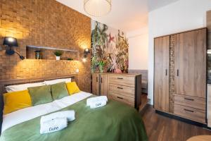 Postel nebo postele na pokoji v ubytování Pokoje, Noclegi, Apartamenty Dune Resort Łeba
