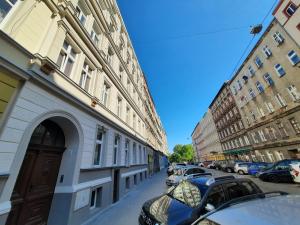 a street with cars parked on the side of a building at Krótkoterminowy Kąt in Wrocław