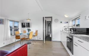 a kitchen and dining room with a table and chairs at Lovely Apartment In Nrre Nebel With Wifi in Nørre Nebel