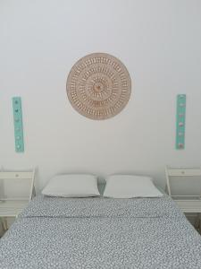 a white bedroom with a bed with at Ferragood House - Historic Center in Ferragudo