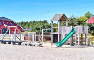 a playground with a green slide and a gazebo at Lovely Apartment In Nrre Nebel With Wifi in Nørre Nebel