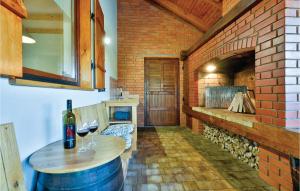 a room with a table and two glasses of wine at Nice Home In Glina With Sauna in Donje Taborište