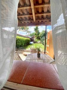 a view of a patio from the outside of a house at CasaMoltoCarina Cottage Garden in Minturno