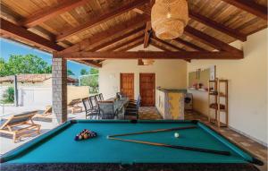 a pool table in the middle of a patio at Nice Home In Skicini With Sauna in Juršići