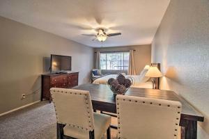 a dining room with a table and chairs and a bedroom at Convenient Pinetop Apt, 1-2 Mi To Golfing! in Indian Pine