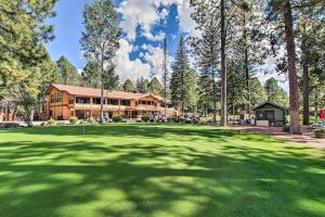 a view of a golf course with a house at Convenient Pinetop Apt, 1-2 Mi To Golfing! in Indian Pine