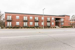 an empty street in front of a red brick building at The Lofts of Downtown (540 N 2nd St, #106) in Clarksville