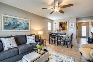 a living room with a couch and a dining room at The Lofts 211 In Historic Downtown Clarksville in Clarksville