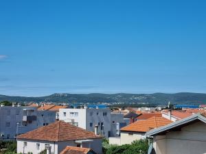 a view of a city with roofs and houses at Sunset View Biograd in Biograd na Moru