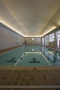 a large swimming pool in a building at Williamsburg Lodge, Autograph Collection in Williamsburg