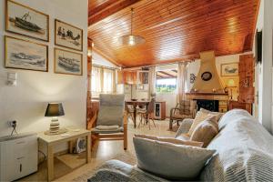 a living room with a couch and a table at Eutuxia House in Corfu