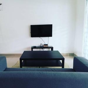 A television and/or entertainment centre at #Guest House near Hub Education University Pagoh