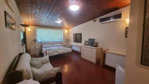 TV a/nebo společenská místnost v ubytování Agriturismo il fragolino