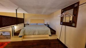 Postel nebo postele na pokoji v ubytování Agriturismo il fragolino