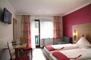 Postel nebo postele na pokoji v ubytování Gasthof-Hotel Dilger