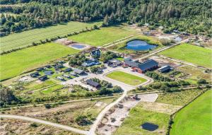 an aerial view of a farm with a lake at 2 Bedroom Awesome Apartment In Nrre Nebel in Nørre Nebel