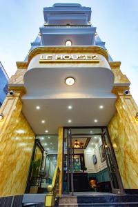 a building with a sign on the front of it at Le House Hotel and Studio in Danang