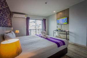 TV a/nebo společenská místnost v ubytování Embryo Hotel 