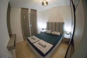 a view of a bedroom with a large bed at Apartman David in Trebinje