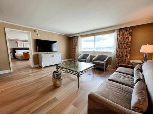 a living room with a couch and a table at The Commerce Casino & Hotel in Commerce