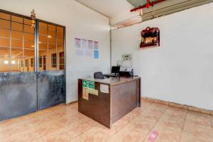 an empty room with a counter in a room at Hotel O Sai Residency in Pune