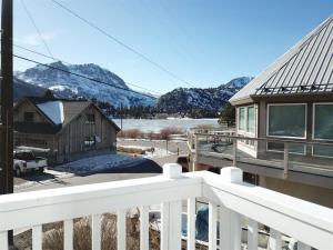 a view from the balcony of a house with snow covered mountains at Rr-gull Lake Baby House in June Lake