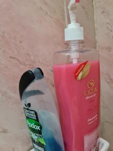 a mouthwash and a bottle of soap on a counter at Hello Pyramids inn in Cairo
