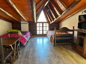 Ένα ή περισσότερα κρεβάτια σε δωμάτιο στο Cabaña Mimi II