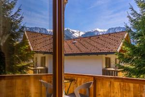 a view from a window of a house with mountains at Appart Taverne in Mayrhofen