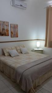 Ένα ή περισσότερα κρεβάτια σε δωμάτιο στο Pousada da Gigoia - Barra da Tijuca