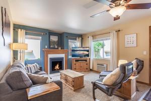 a living room with a couch and a fireplace at DAS BAVARIAN CONDO, 5 Star Ground Floor Unit, Walk to Town, Sleeps 6 in Leavenworth