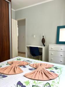 Uma cama ou camas num quarto em Apartamento mobiliado Piracicaba