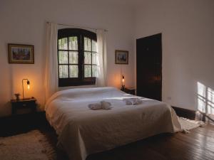 Una cama o camas en una habitación de Casa al pie de la Montaña