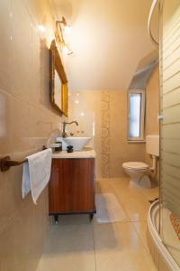 a bathroom with a sink and a toilet at Apartments by the sea Kastel Novi, Kastela - 21210 in Kaštela