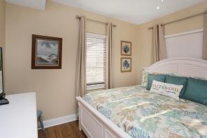 a bedroom with a bed and a window at Club at Mexico Beach 2D by Pristine Properties Vacation Rentals in Mexico Beach