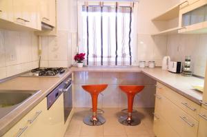 Kuchyň nebo kuchyňský kout v ubytování Apartment Adagio