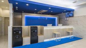 a store with two refrigerators on display in a building at Toyoko Inn Nagano-eki Higashi-guchi in Nagano