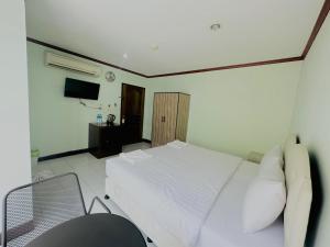 TV a/nebo společenská místnost v ubytování Cocoon Omaya Guest House