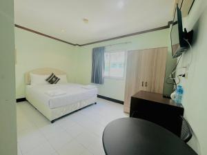 Postel nebo postele na pokoji v ubytování Cocoon Omaya Guest House