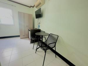 TV a/nebo společenská místnost v ubytování Cocoon Omaya Guest House