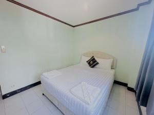 Postel nebo postele na pokoji v ubytování Cocoon Omaya Guest House