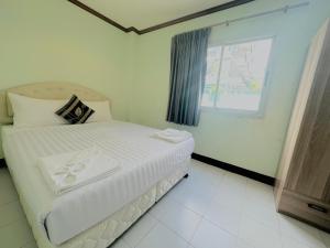 Postel nebo postele na pokoji v ubytování Cocoon Omaya Guest House