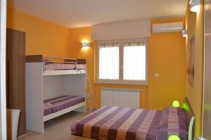 a bedroom with two bunk beds and a bed at La Stella di Gallipoli in Gallipoli +16 photos