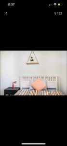 a picture of a bedroom with a bed and a desk at Private Room in Shared Accommodation in Redcliffe